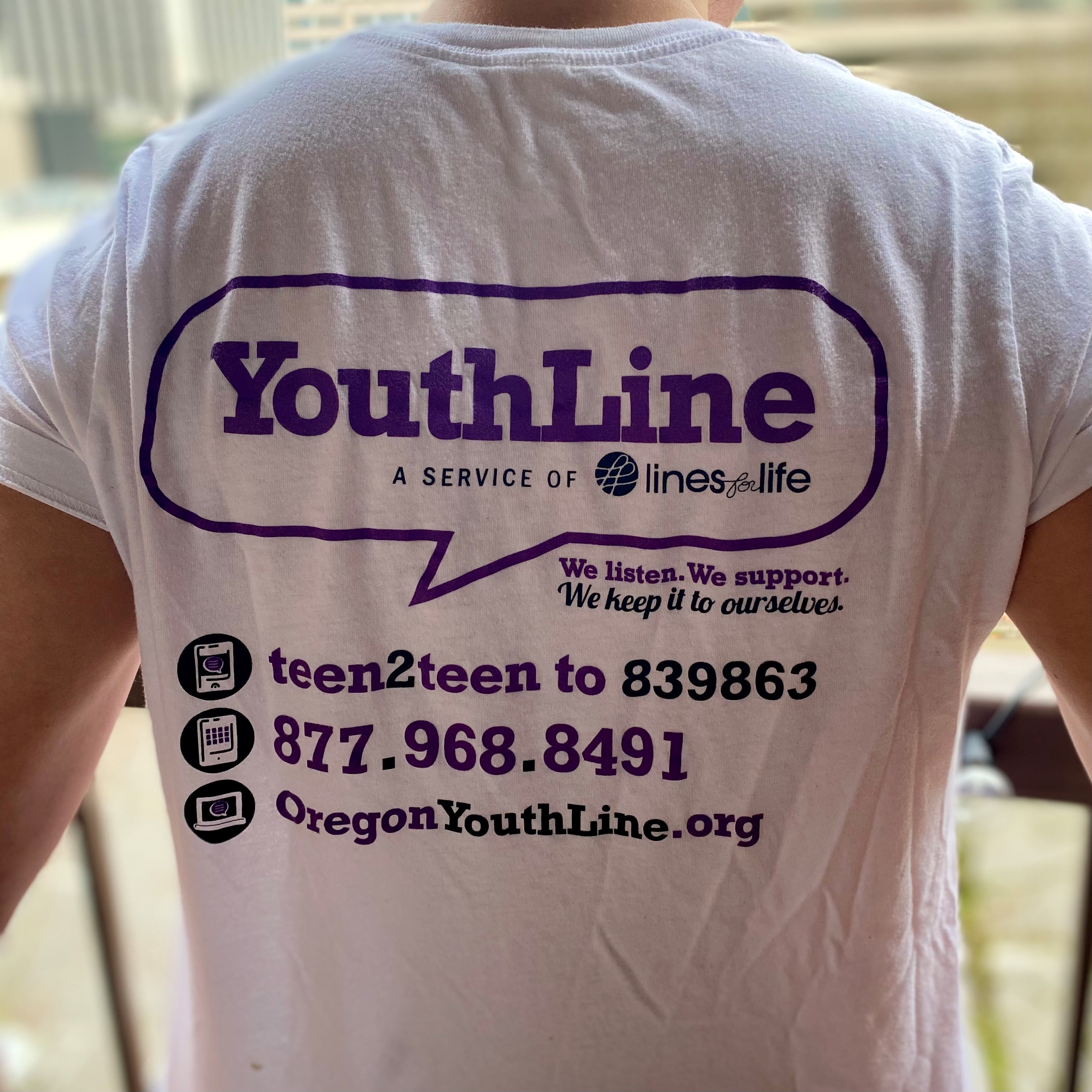 Back of t-shirt with text about YouthLine