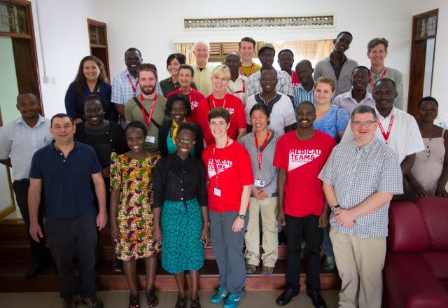 A group of people standing together for a photograph