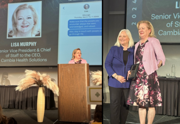 Woman accepting award on stage